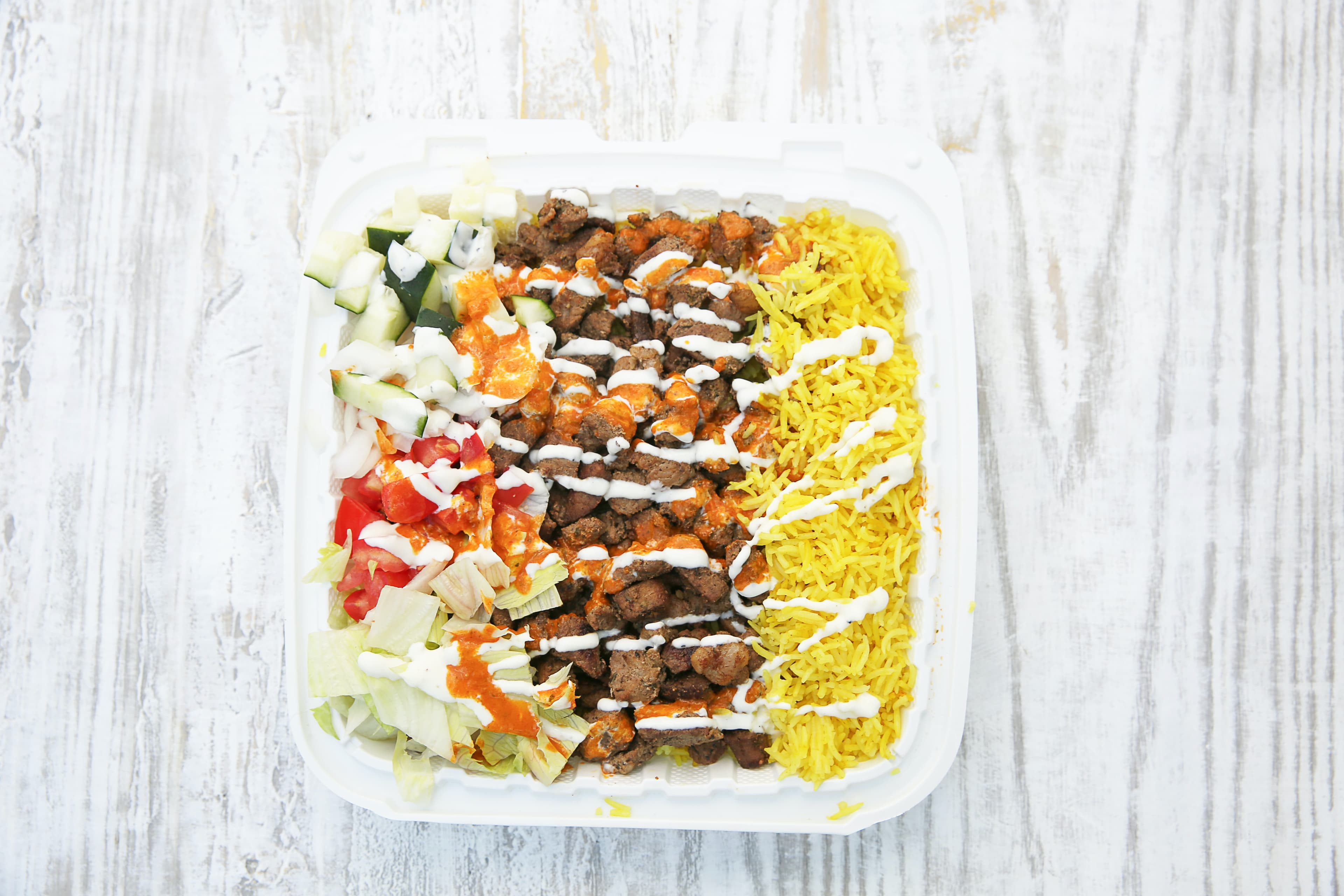 Tender beef over rice platter