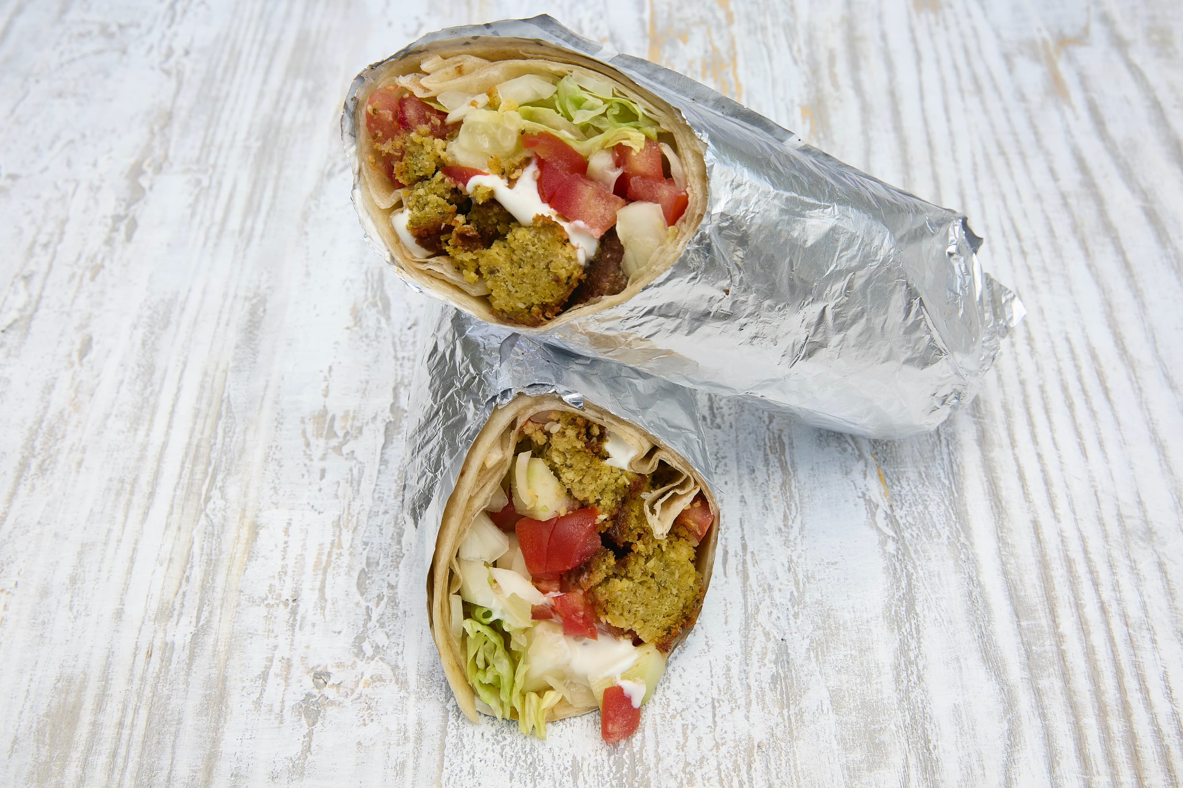 Fresh falafel wrap with tahini sauce